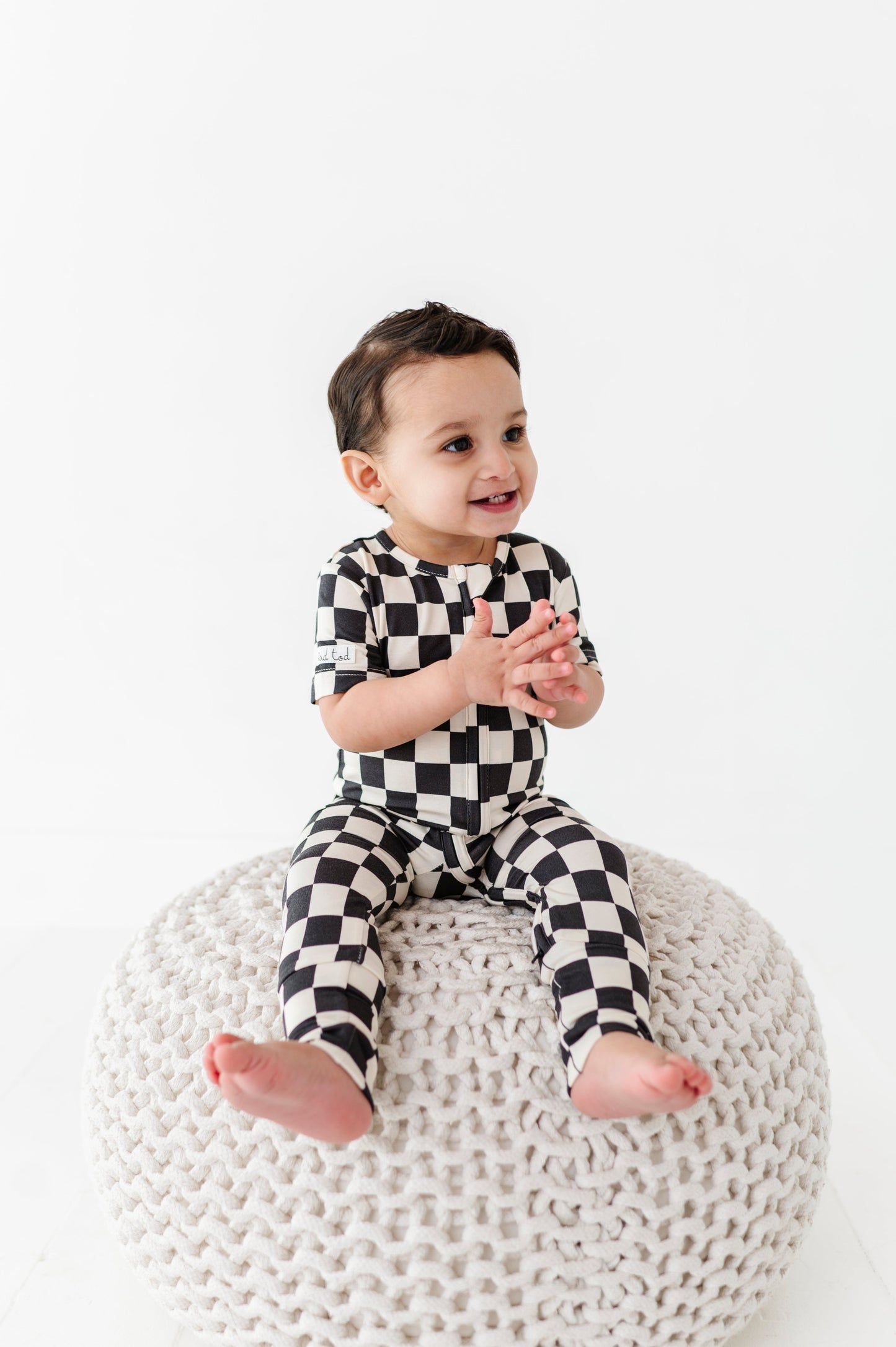 BAMBOO - BLACK CHECKERED SHORT SLEEVE ONESIE