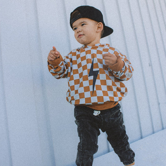 THE CHECKERED SPARK HOODIE - RUST
